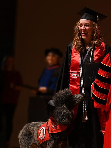 Graduate with service dog