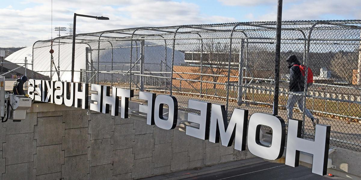 "Home of the Huskies" on pedestrian bridge